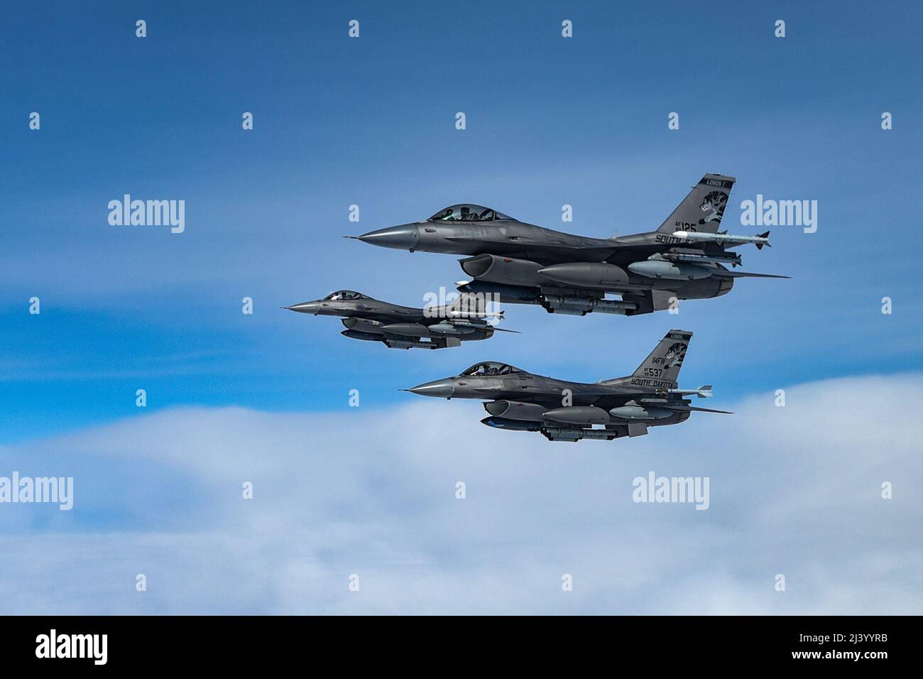 Three F-16 Fighting Falcons assigned to the 114th Fighter Wing, fly alongside of a KC-135 Stratotanker from the 185th Air Refueling Wing, while traveling to Weapons and Tactics Instructor (WTI) course 2-22 at Marine Corps Air Station Yuma, Ariz., April 1, 2022. WTI is a seven-week training event hosted by Marine Aviation Weapons and Tactics Squadron One (MAWTS-1), providing standardized advanced tactical training and certification of unit instructor qualifications to support Marine aviation training and readiness, and assists in developing and employing aviation weapons and tactics. (U.S. Air Stock Photo