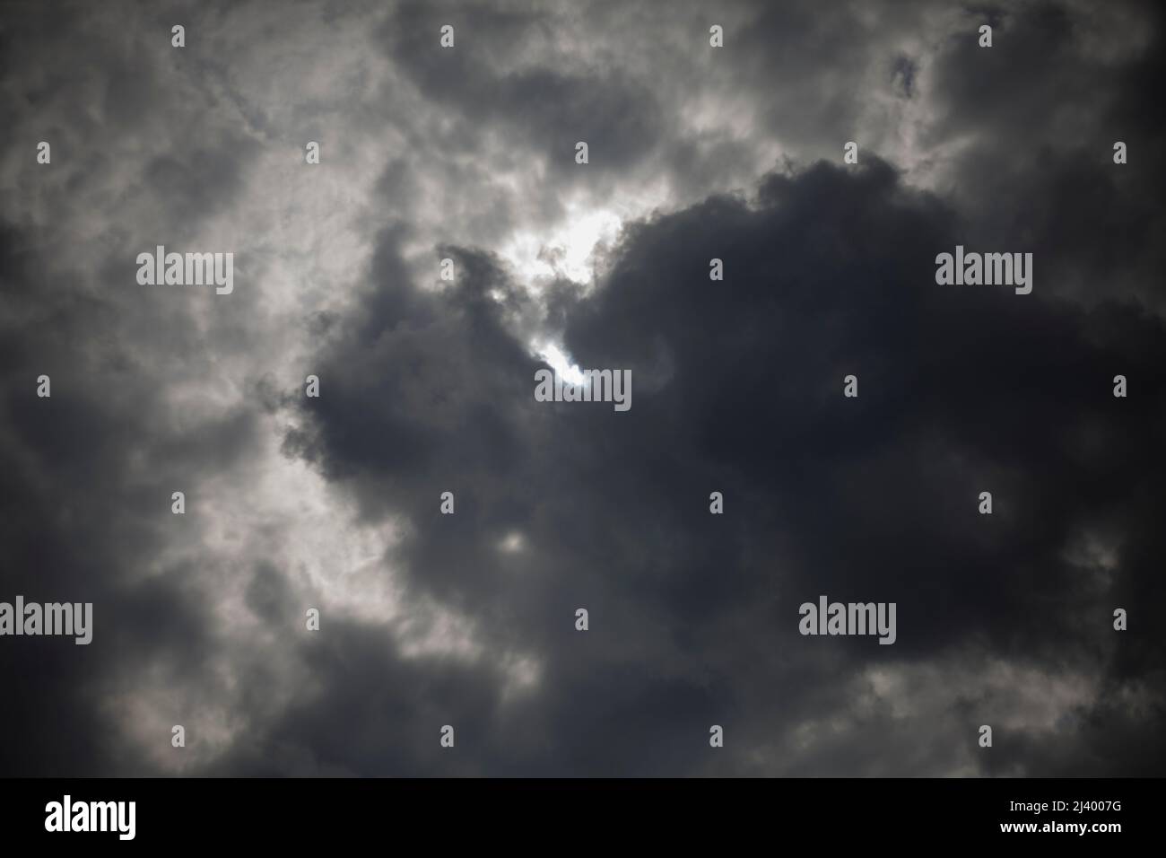 Cloudy sky. Sun behind cloud. Cloudy day. Windy weather Stock Photo Alamy