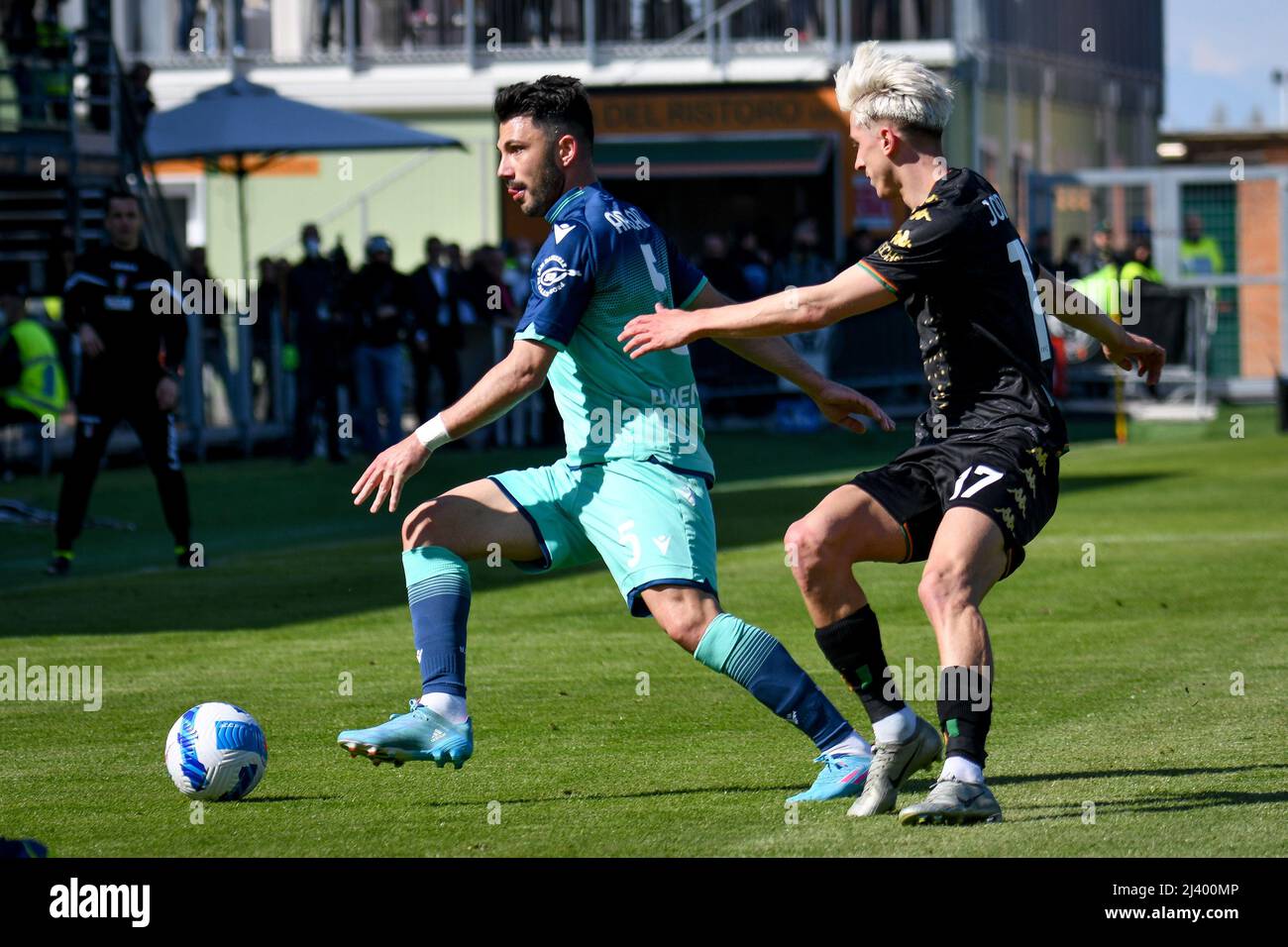 Venice, Italy. 10th Apr, 2022. Udinese's Tolgay Arslan hindered by Venezia's  Dennis Johnsen during Venezia FC vs Udinese Calcio, italian soccer Serie A  match in Venice, Italy, aprile 10 2022 Credit: Independent