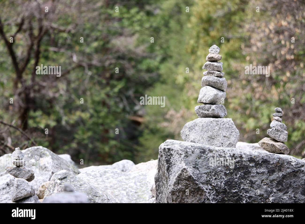 Stone cairns created by hikers in a rock garden at Mirror Lake, Yosemite National Park. Stock Photo