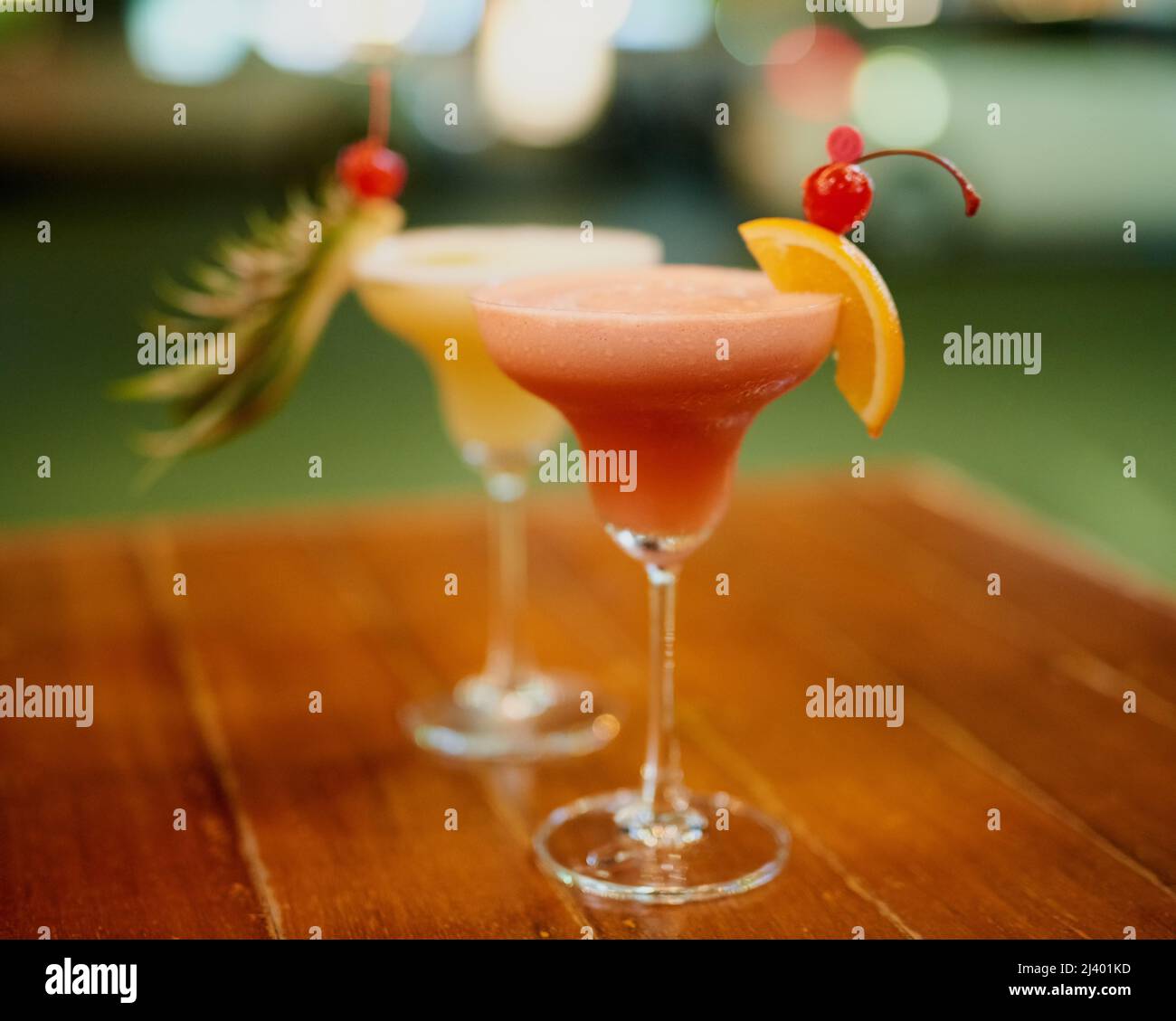 Expertly mixed. Shot of two fruity cocktails on a table in a bar. Stock Photo