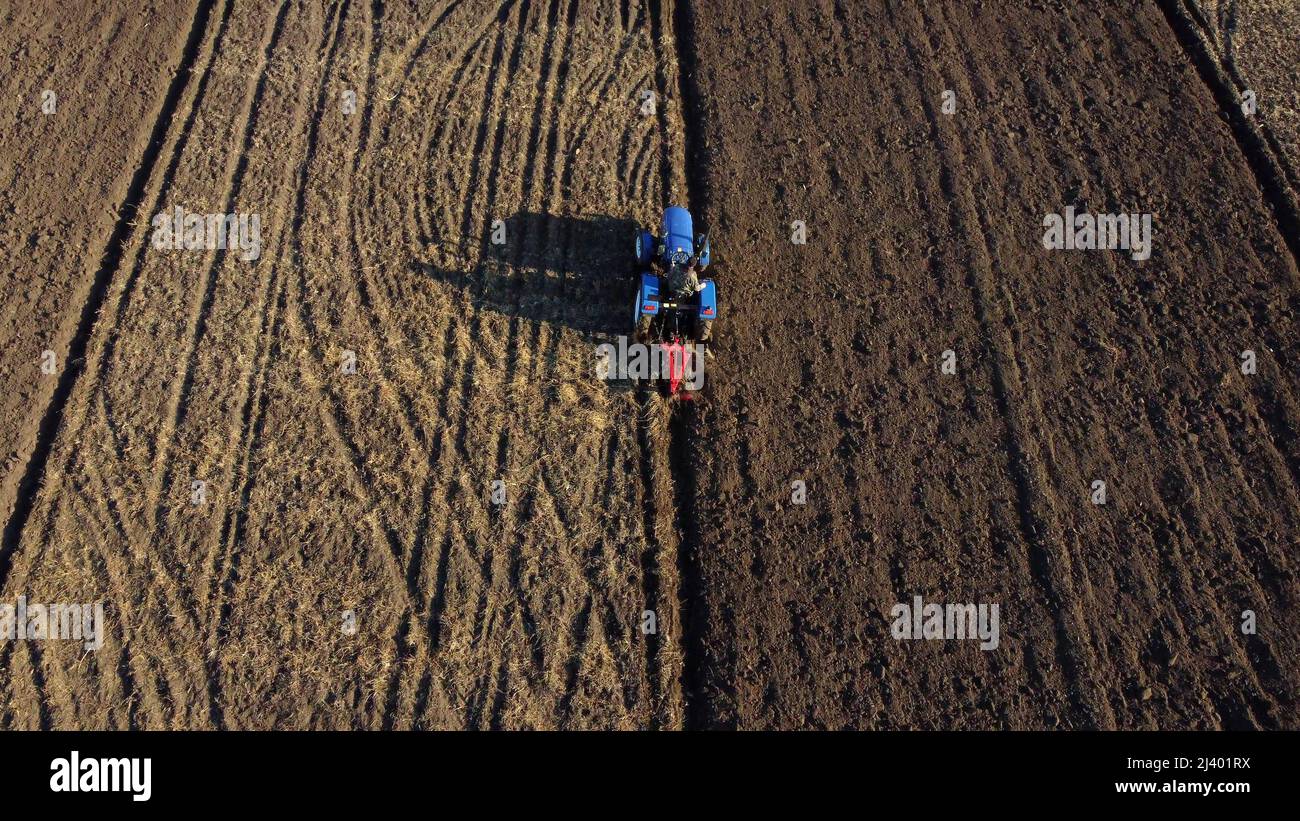 Flight over tractor plows land hi-res stock photography and images - Alamy