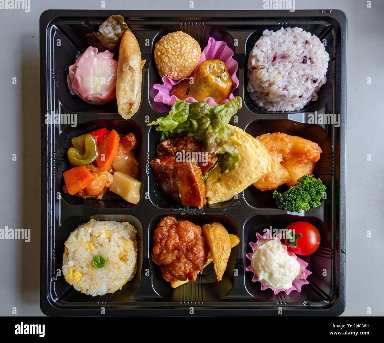 Japanese bento lunch tray with variety of small dishes Stock Photo Alamy