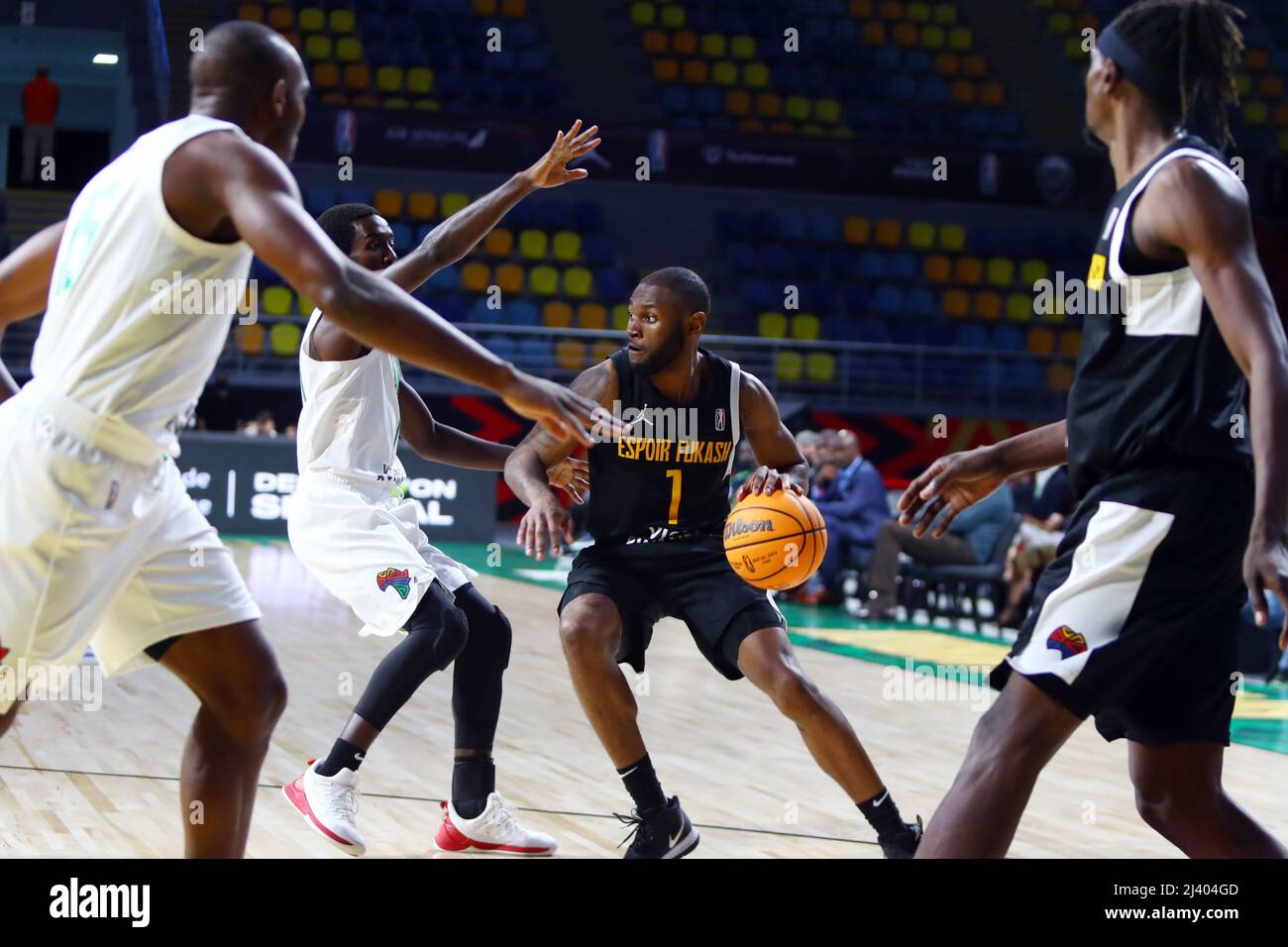 Cairo, Egypt. 10th Apr, 2022. Narcisse Greg Ambanza (2nd R) of BC Espoir Fukash dribbles the ball during the match between Forces Armees et Police Basketball (FAP) of Cameroon and BC Espoir Fukash of Congo at the 2022 Basketball Africa League (BAL) in Cairo, Egypt, on April 10, 2022. Credit: Ahmed Gomaa/Xinhua/Alamy Live News Stock Photo