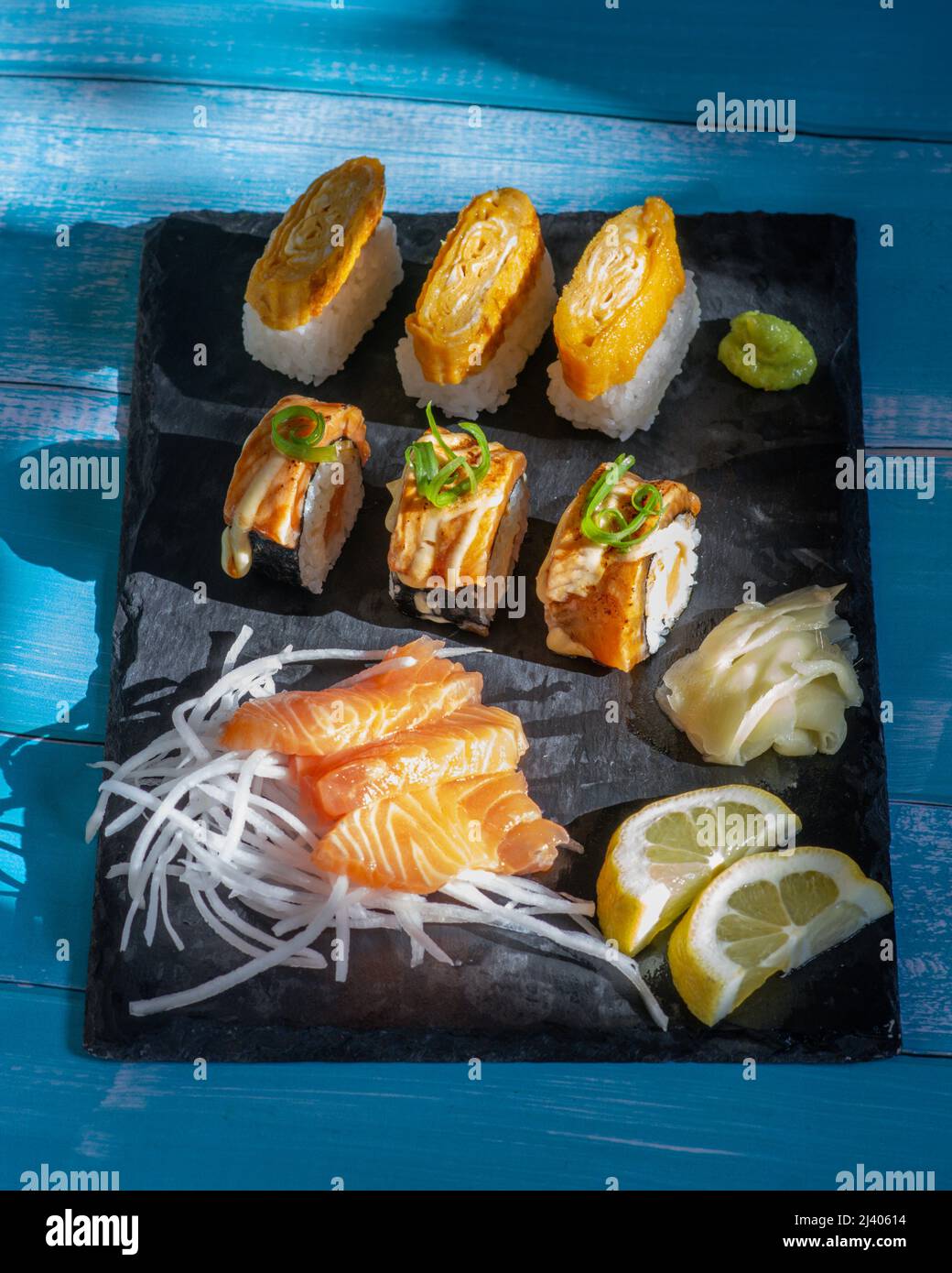 Assorted Sushi and Sashimi Platter. Salmon Sushi Rolls, Salmon Sashimi