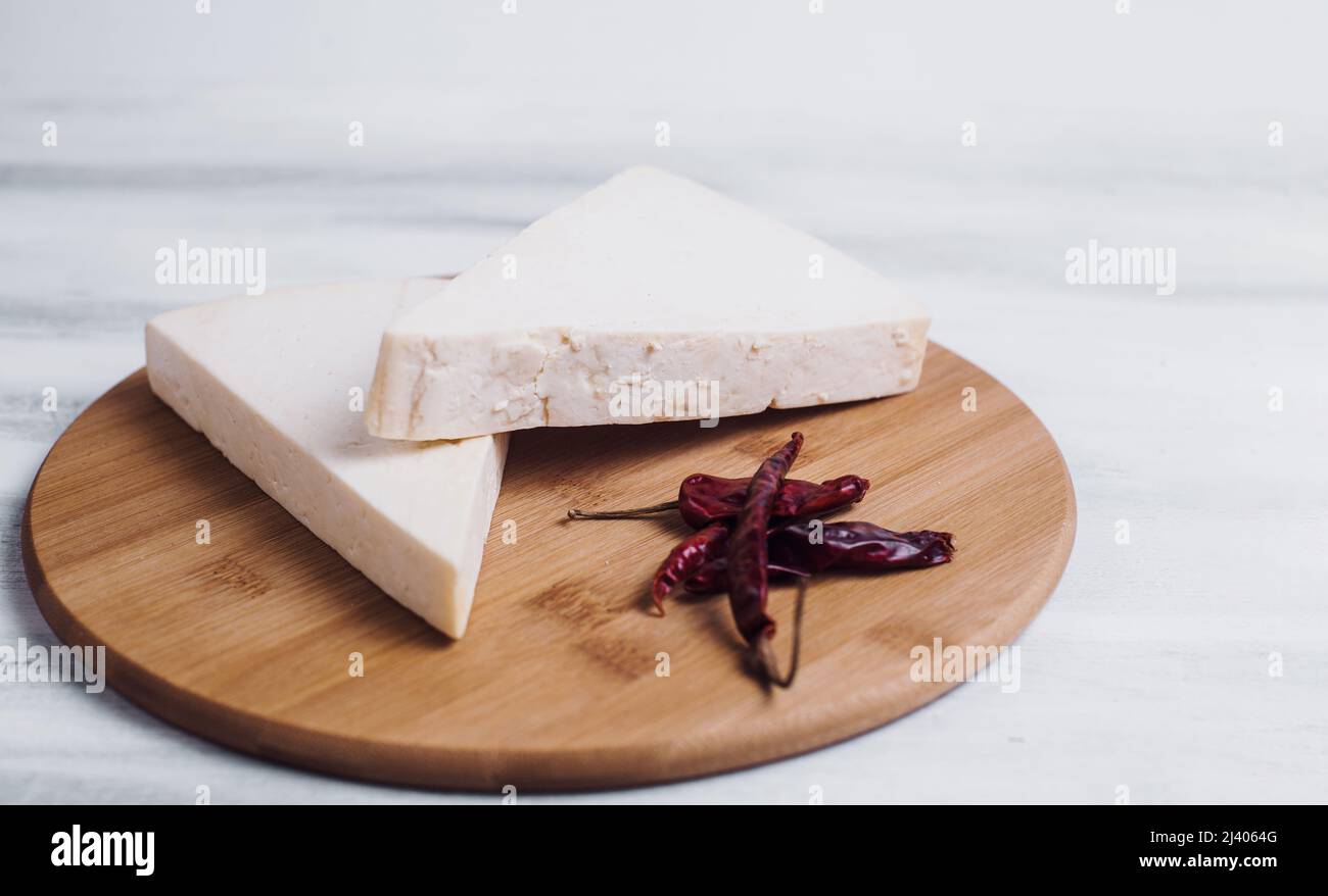 Mexican white Cotija cheese with fresh ingredients in Mexico Latin