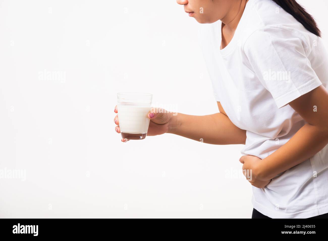Closeup young woman intolerant use hand holding glass milk she is bad