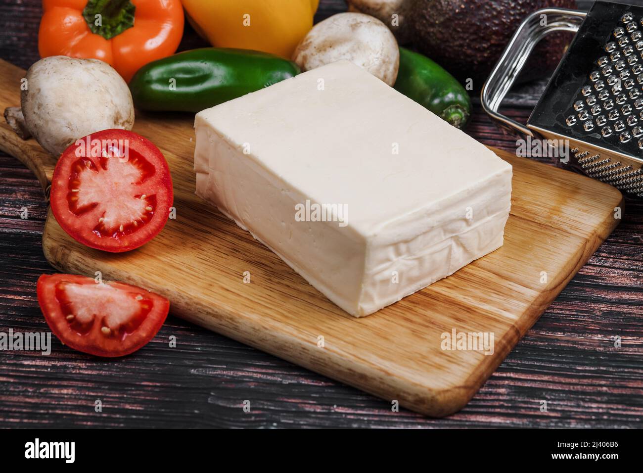 Mexican Chihuahua cheese or mennonite cheese and tequila or mezcal shot from Mexico Latin America Stock Photo