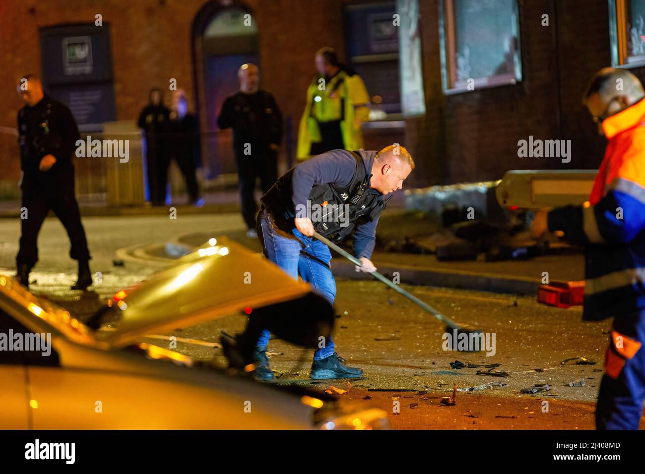 Middleton, UK. 11th Apr, 2022. A police officer sweeps away the derby