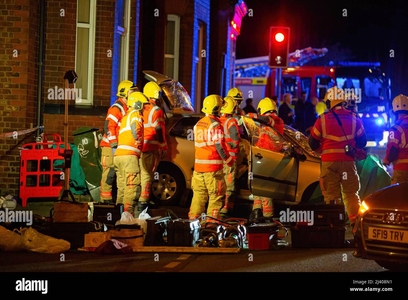 Middleton, UK. 10th Apr, 2022. Firefighters work on a vehicle to get