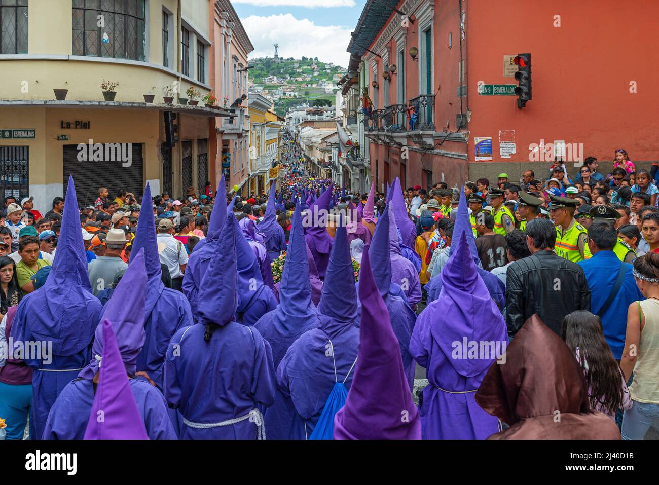 Cucurucho penitents in traditional purple costume with pointy hats during the Good Friday Easter procession in the streets of Quito, Ecuador. Stock Photo