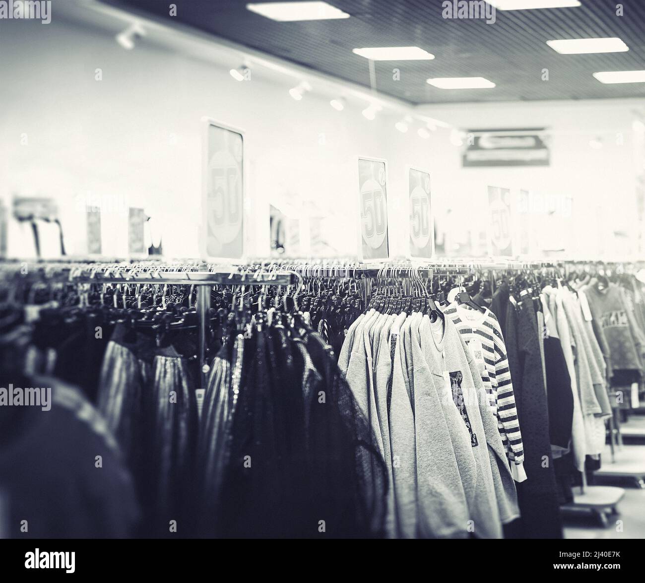 outerwear hangs in clothes store Stock Photo