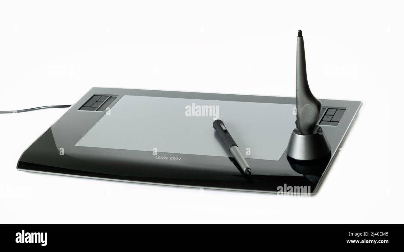 Wacom digital tablet and pens on white Stock Photo