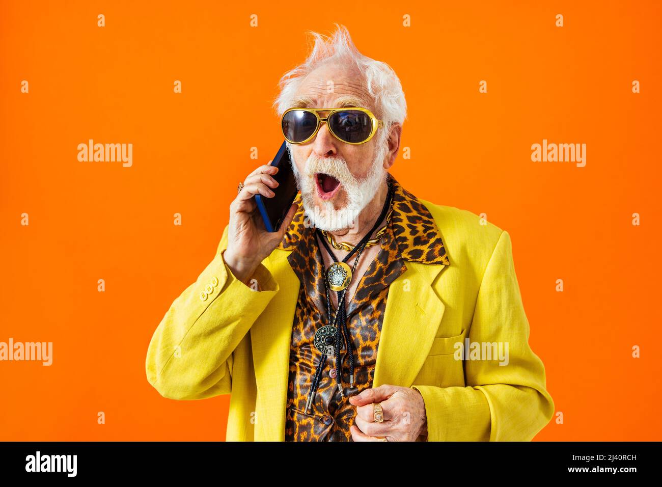 Cool senior man with fashionable clothing style portrait on colored  background - Funny old male pensioner with eccentric style having fun Stock  Photo - Alamy