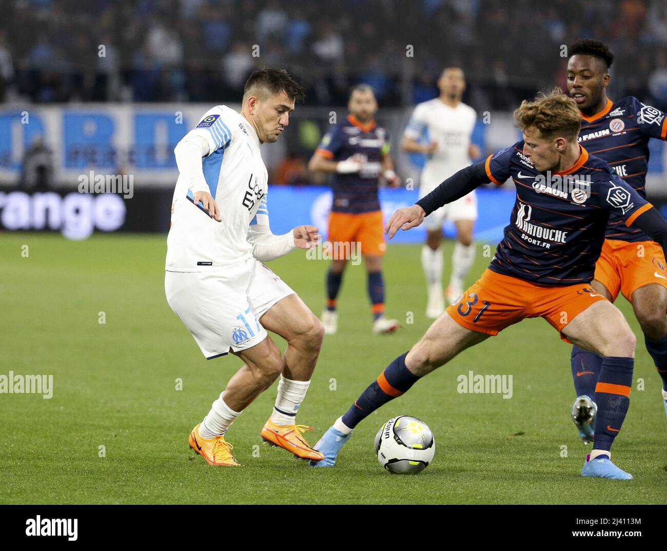 Cengiz Under of Marseille, Nicolas Cozza of Montpellier during the French  championship Ligue 1 football match between Olympique de Marseille (OM) and  Montpellier HSC (MHSC) on April 10, 2022 at Stade Velodrome