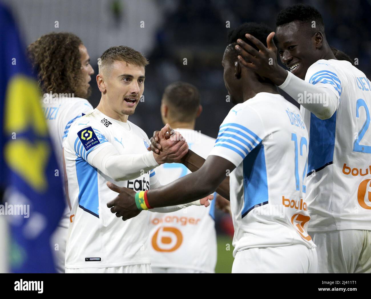 April 10, 2022, Marseille, France: Bamba Dieng of Marseille celebrates his goal with Valentin Rongier (left), Pape Gueye during the French championship Ligue 1 football match between Olympique de Marseille (OM) and Montpellier HSC (MHSC) on April 10, 2022 at Stade Velodrome in Marseille, France - Photo Jean Catuffe/DPPI/LiveMedia. (Credit Image: © Jean Catuffe/LPS via ZUMA Press) Stock Photo