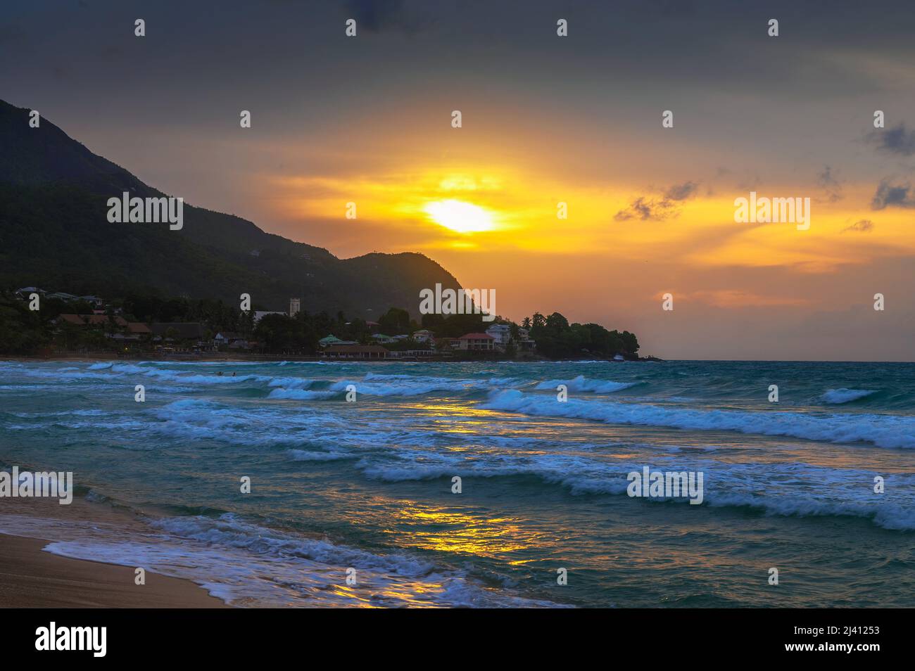 Sunset over the Beau Vallon Beach on the island of Mahe, Seychelles Stock Photo