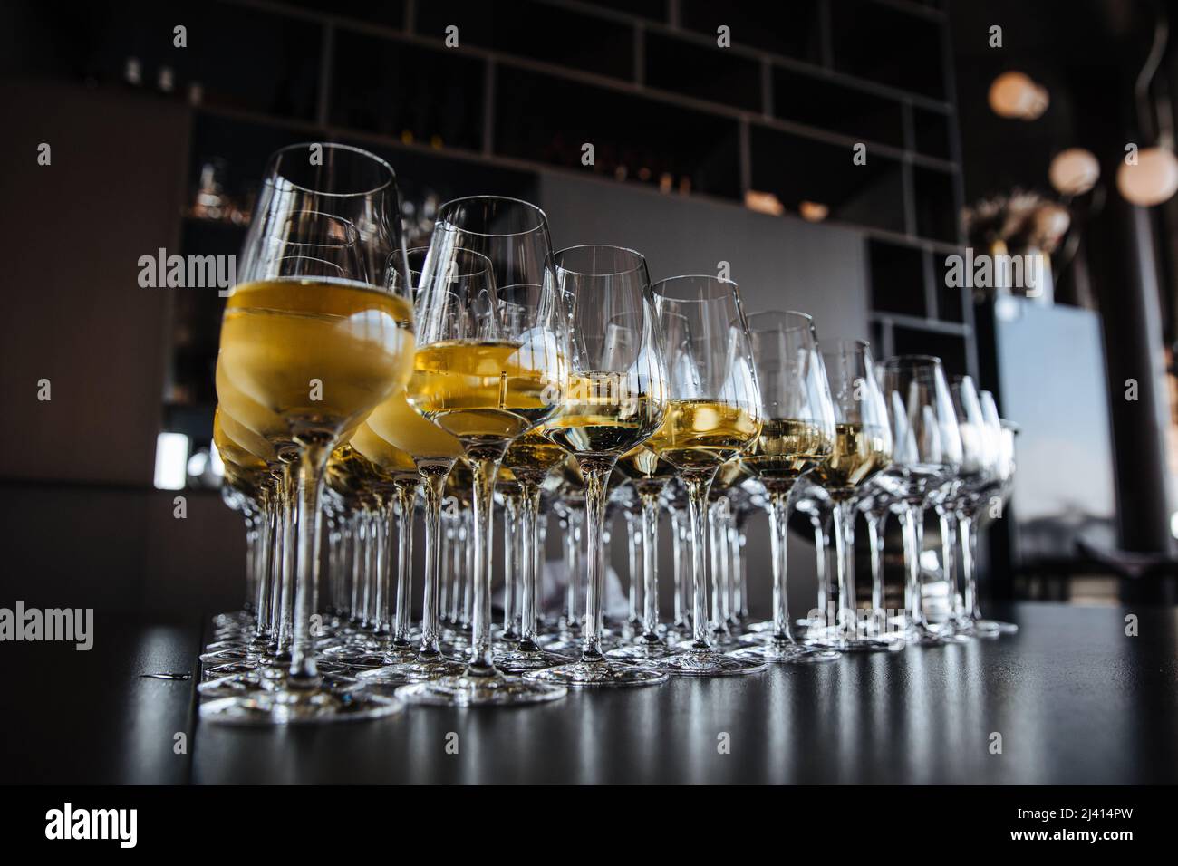 Stylish golden champagne in glasses. Anniversary celebration concept, christmas celebration. luxury catering at feast. Stock Photo