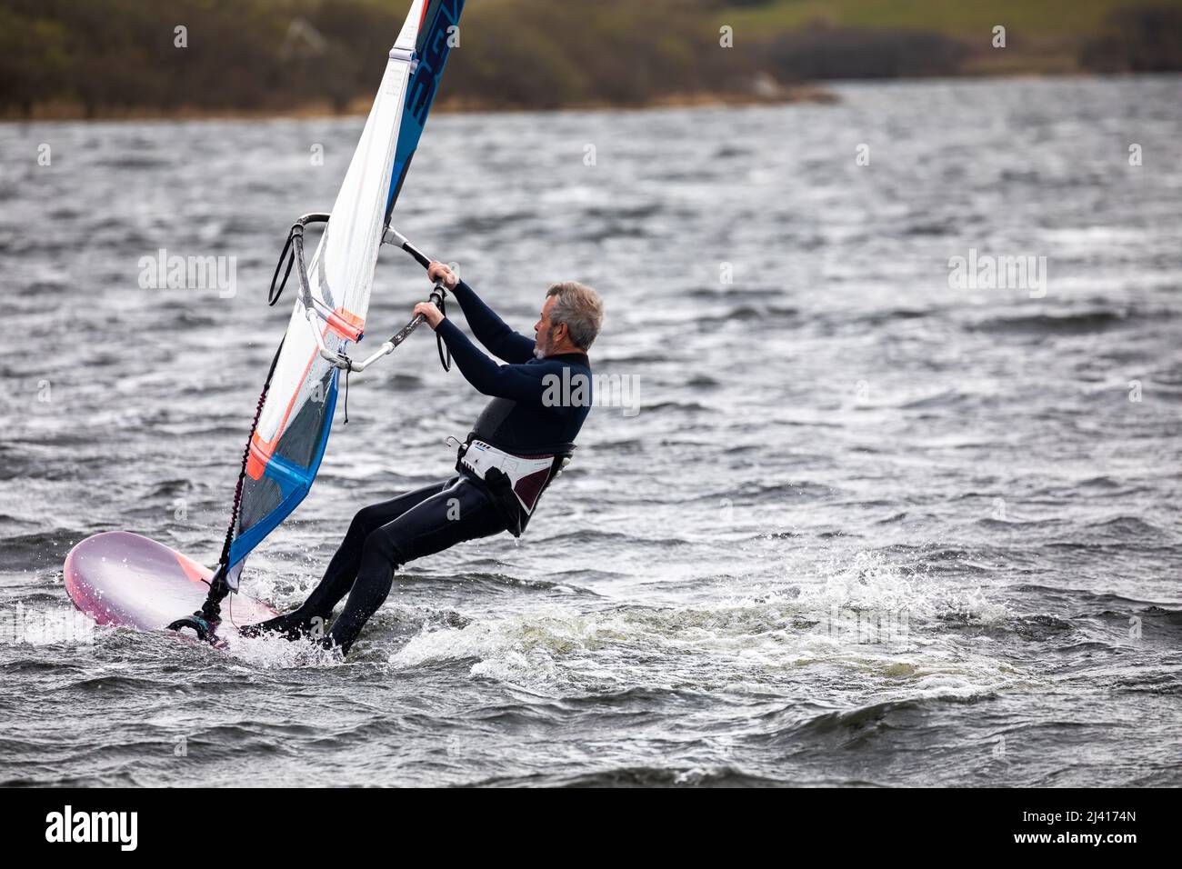 People wind foiling on Stithians Lake, Menherion in South West Cornwall