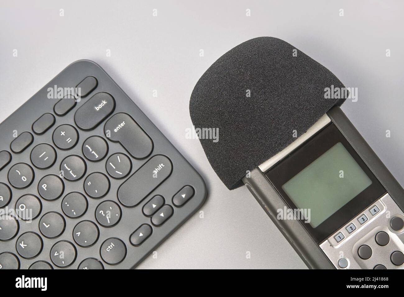 Podcast concept. Black microphone recorder, content notebook keypad