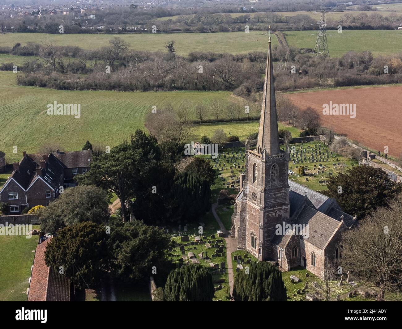 An aerial view of St Michaels church in Winterbourne, Built in the 12th century and designated by English Heritage as a grade I listed building Stock Photo