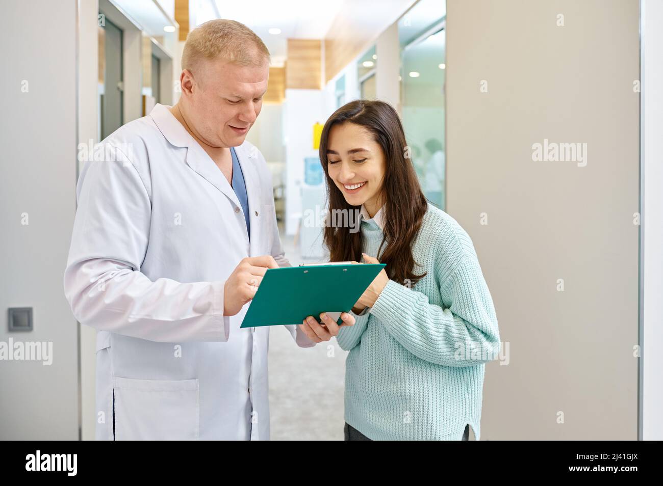 Doctor and patient discussing medical checkup results Stock Photo