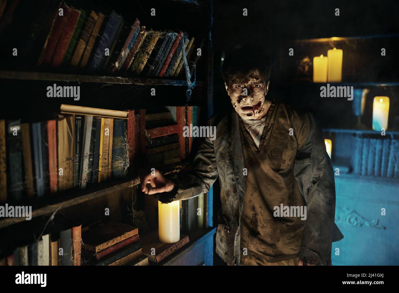 Portrait of zombie man in abandoned library Stock Photo