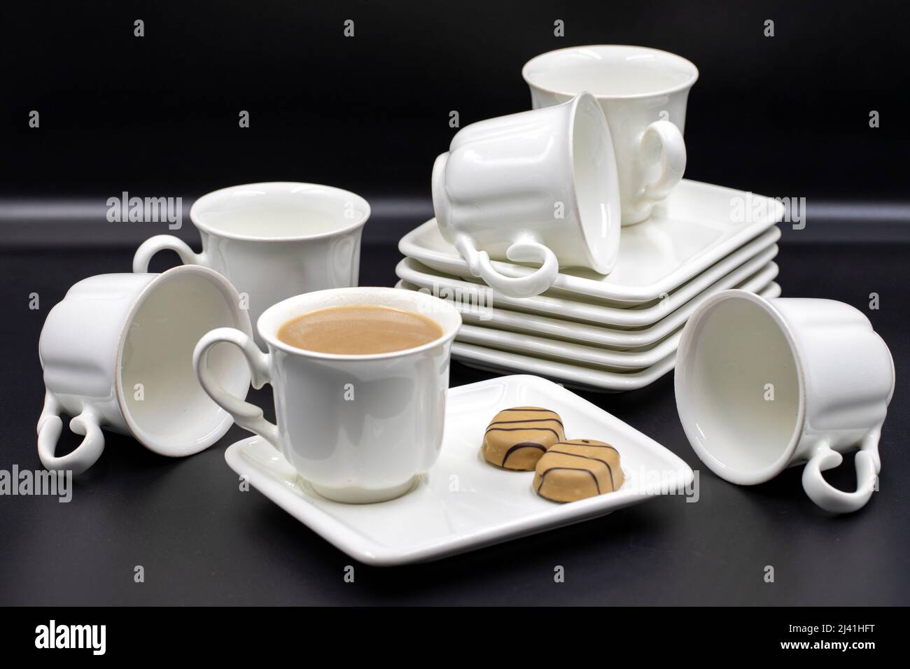 Porcelain coffee set on a black background. Close up Stock Photo - Alamy