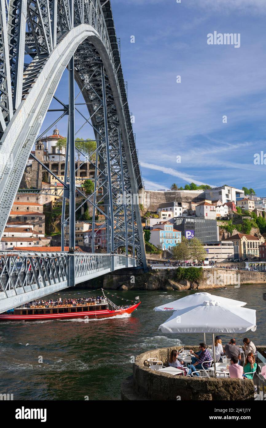 Luís I Bridge (Ponte Luís I) across the Douro River with Restaurant and Pleasure Boat, Porto, Portugal, Europe Stock Photo
