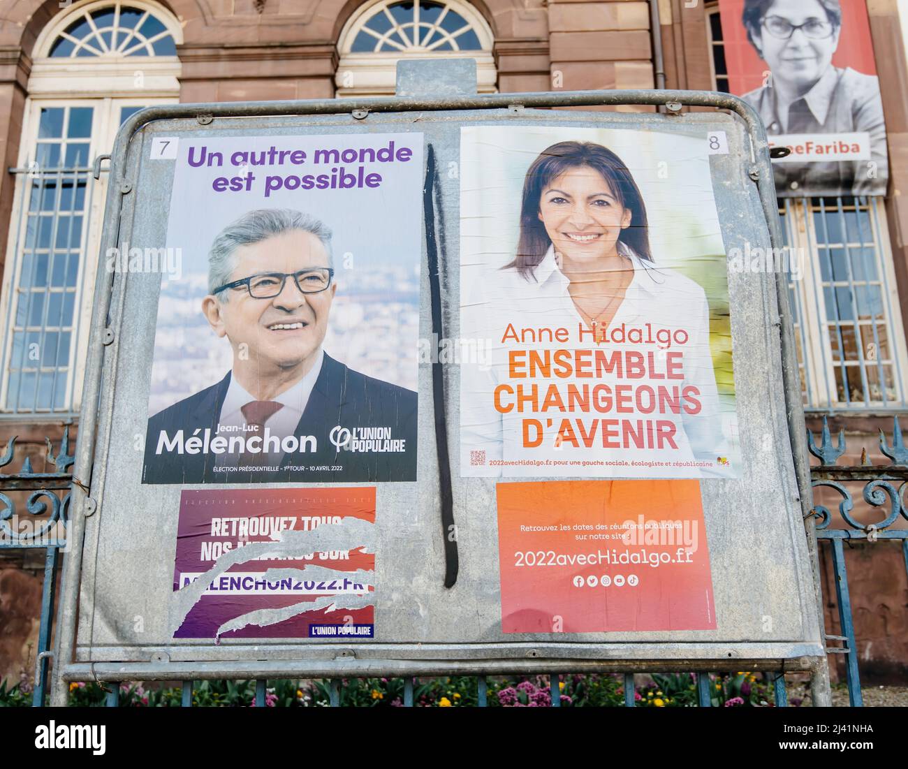 STRASBOURG, FRANCE - APR 23, 2022: French presidential posters for the upcoming presidential election in France, in front of the City Hall building in Strasbourg featuring Anne Hidalgo and Jean-Luc Melenchon Stock Photo