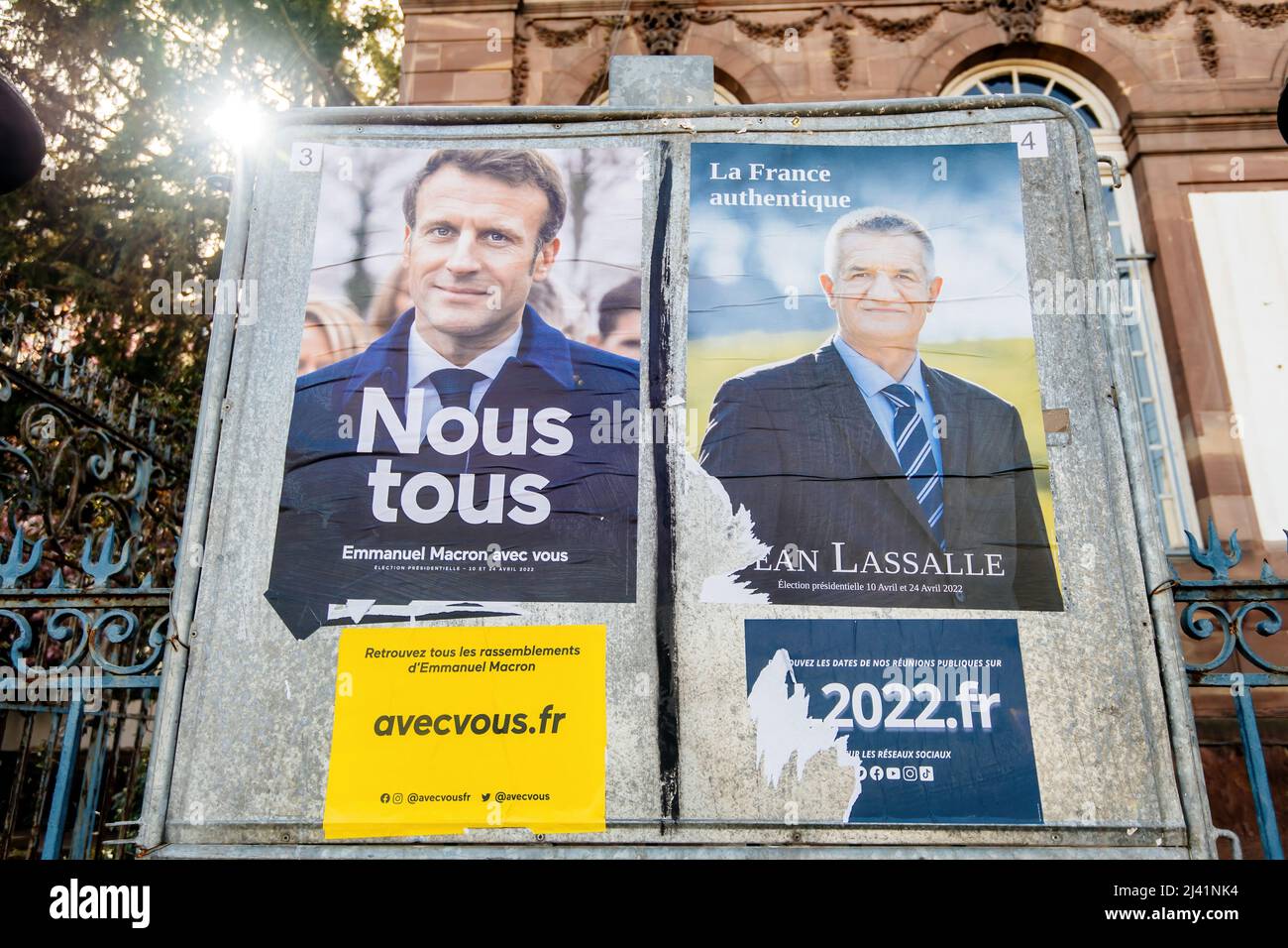 STRASBOURG, FRANCE - APR 23, 2022: French presidential posters for the upcoming presidential election in France, in front of the City Hall building in Strasbourg featuring Emmanuel Macron and Jean Lassale Stock Photo