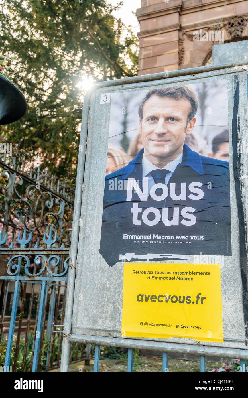STRASBOURG, FRANCE - APR 23, 2022: French presidential posters for the upcoming presidential election in France, in front of the City Hall building in Strasbourg featuring Emmanuel Macron Stock Photo
