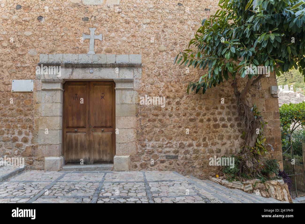The door of the old church in Fornalutx, Soller area. Majorca. Balearic Islands, Spain. Stock Photo