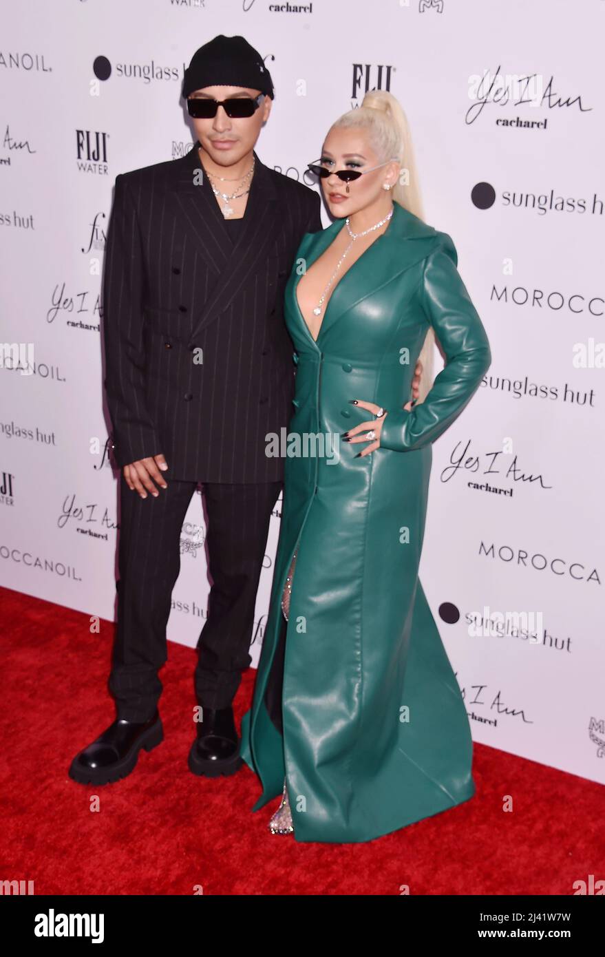 BEVERLY HILLS, CA - APRIL 10: (L-R) Etienne Ortega and Christina
