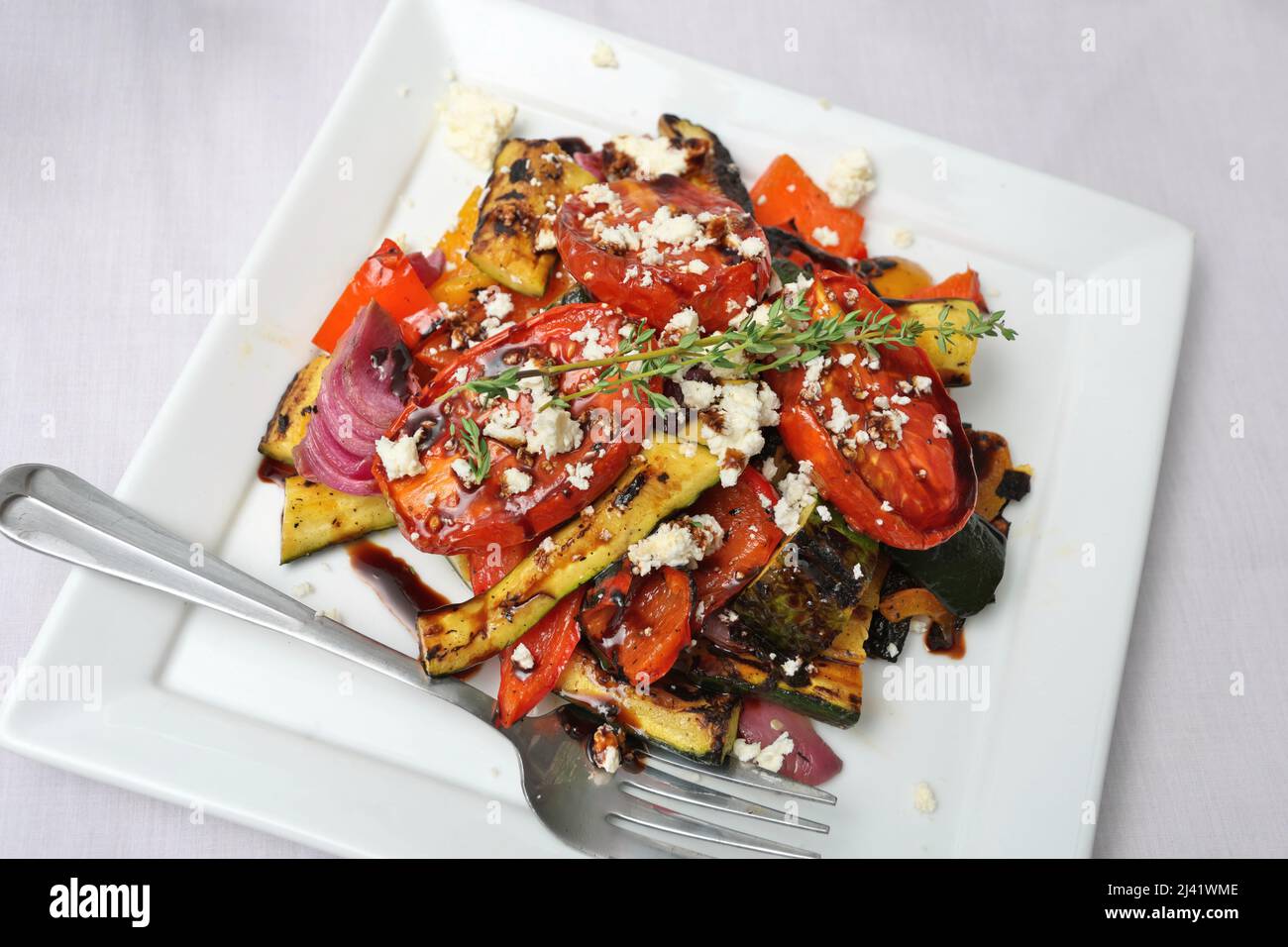 Grilled Tomatoes Peppers Zucchinis Red Onion Drizzled with Balsamic Vinegar and Crumbled Feta Cheese Stock Photo