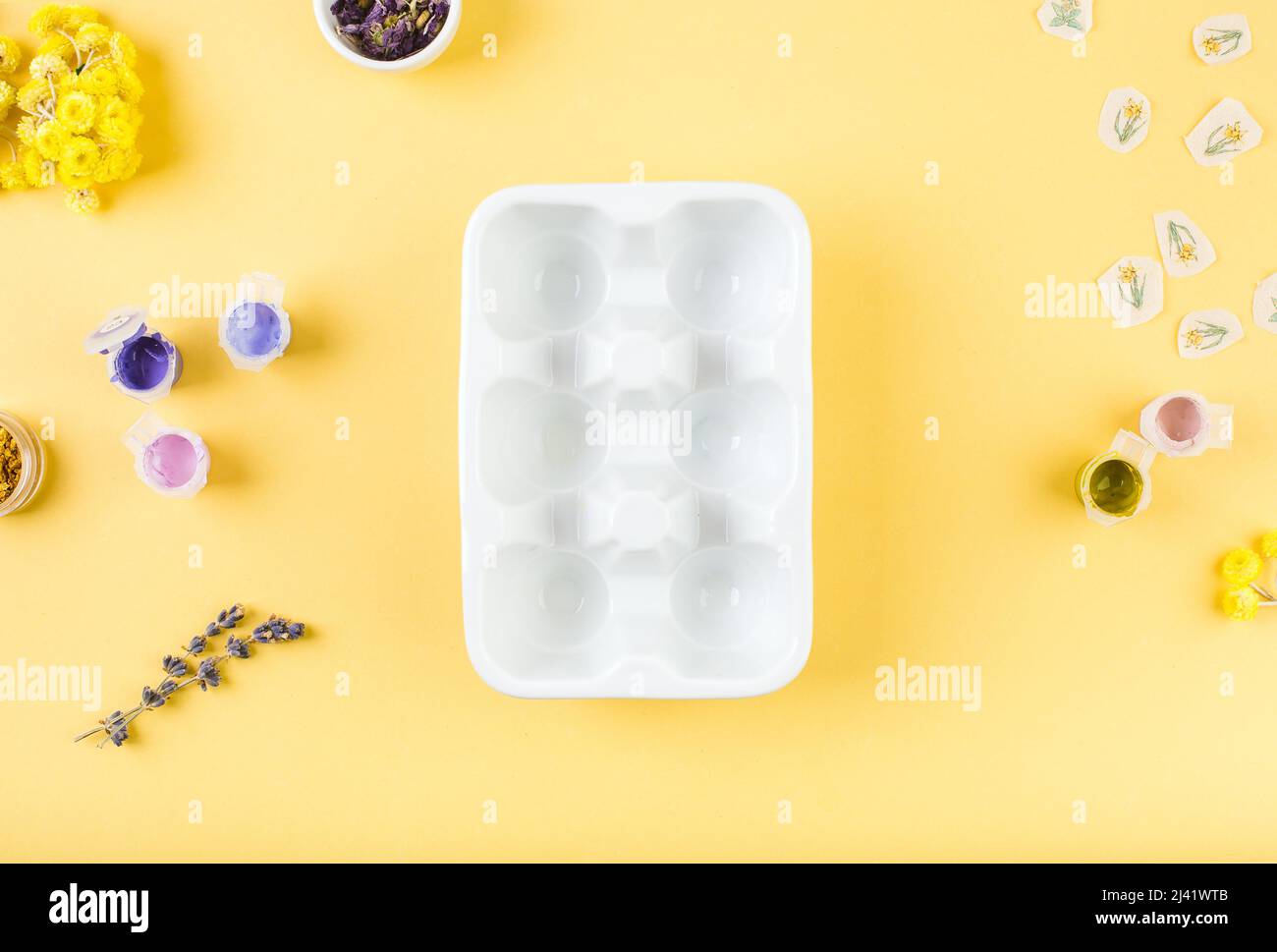 Plate for eggs on yellow background. Minimal happy easter concept. Top view. Stock Photo