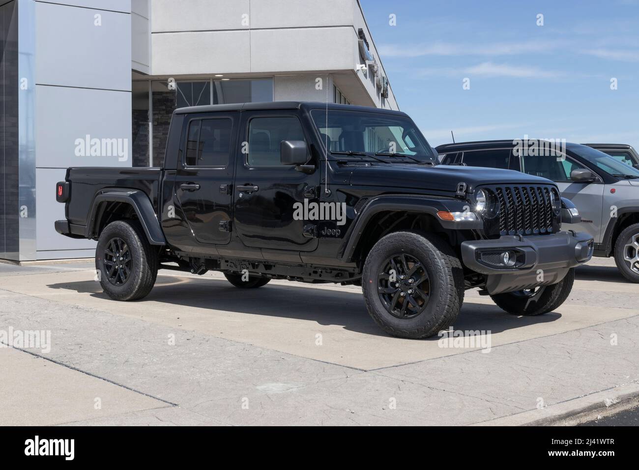 Kokomo - Circa April 2022: Jeep Gladiator display at a Stellantis dealer. The Jeep Gladiator models include the Sport, Willys, Rubicon and Mojave. Stock Photo