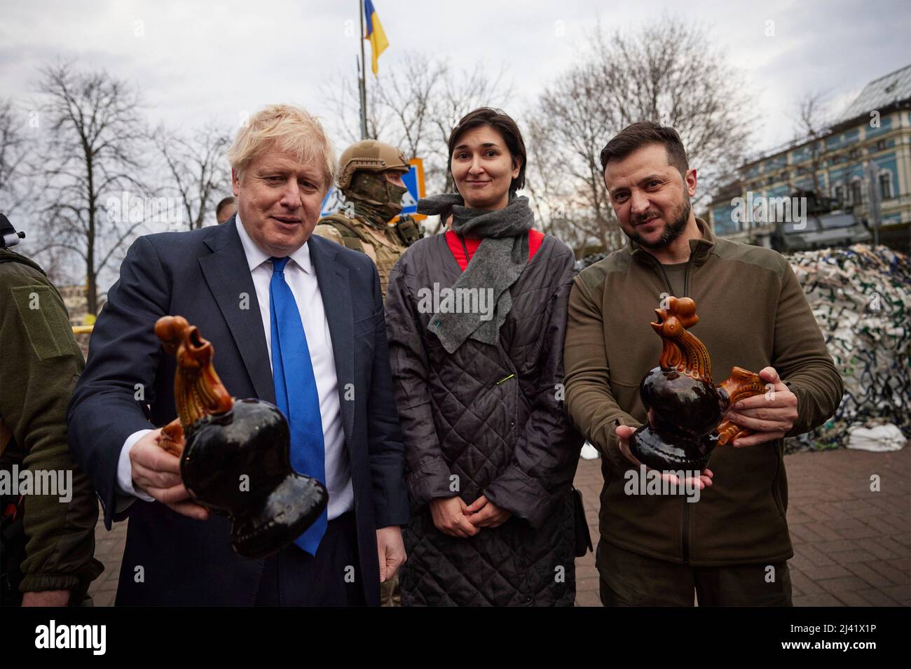 Kyiv, Ukraine. 09 April, 2022. Ukrainian President Volodymyr Zelenskyy, right, and British Prime Minister Boris Johnson, left, hold souvenirs gifted them by a resident, during a walk through the streets of the capital following bilateral discussions, April 9, 2022 in Kyiv, Ukraine.  Credit: Ukraine Presidency/Ukraine Presidency/Alamy Live News Stock Photo