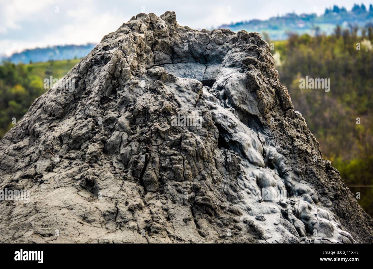 mud volcano or mud dome in Italy, geological phenomenon by eruption of mud, water and methane gas Stock Photo