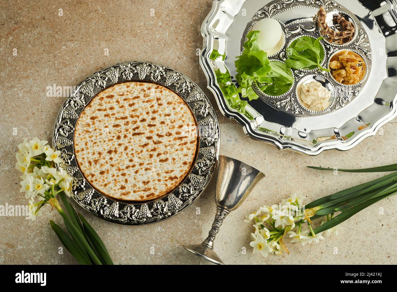 Passover Seder plate with traditional food ontravertine stone ...