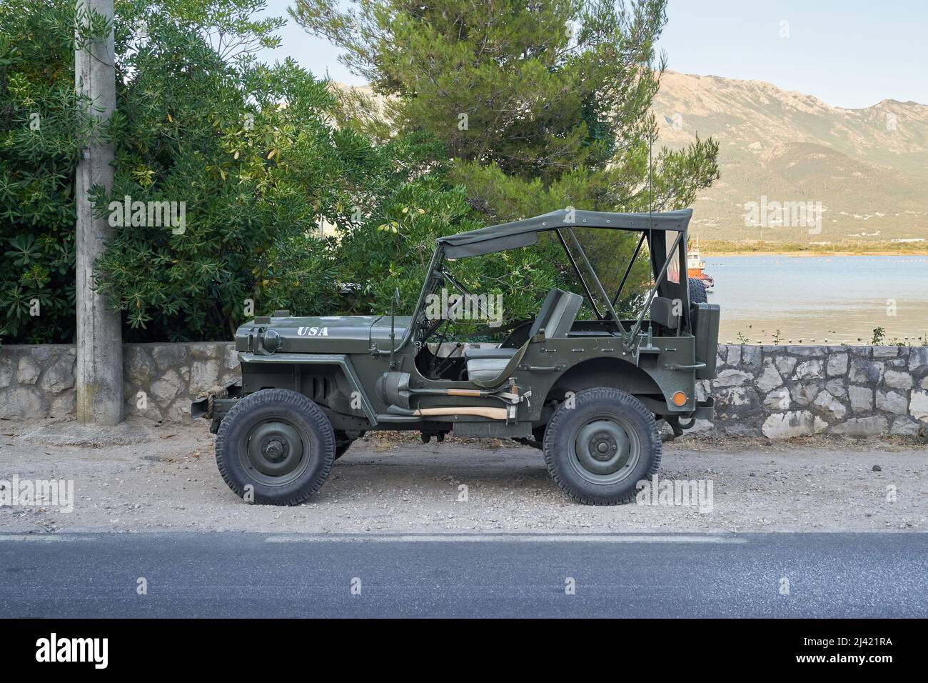 TIVAT, MONTENEGRO - JULY 16, 2021: Military retro Willys Jeep parked on the roadside Stock Photo