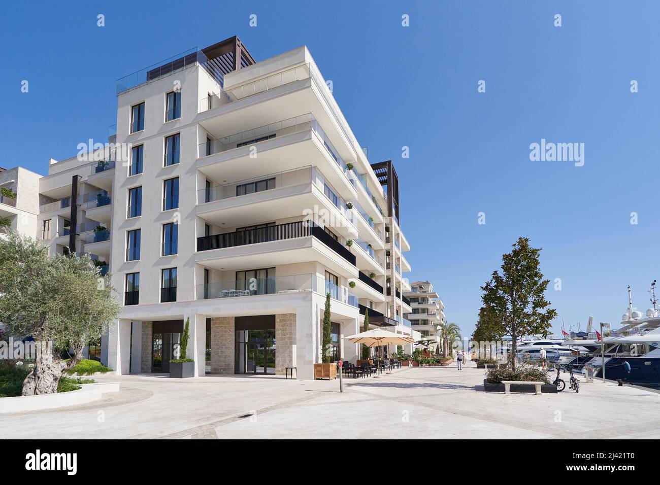 TIVAT, MONTENEGRO - JULY 15, 2021: Modern luxury building with apartments by the sea in Porto Montenegro Stock Photo