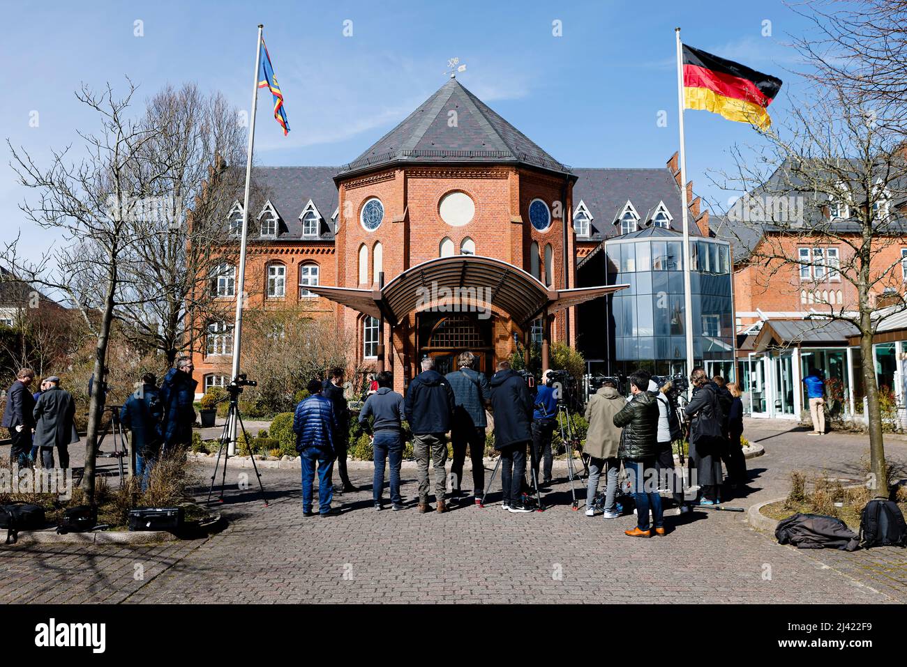 Husum, Germany. 11th Apr, 2022. Media representatives wait in front of the hotel 'Altes Gymnasium' in Husum for a statement from the federal chairwoman of Bündnis 90/Die Grünen. The Green Party leadership wants to make a proposal for the successor to the resigned Family Minister Spiegel (Greens) in a timely manner. This said co-party leader Nouripour on Monday in Husum. Credit: Frank Molter/dpa/Alamy Live News Stock Photo