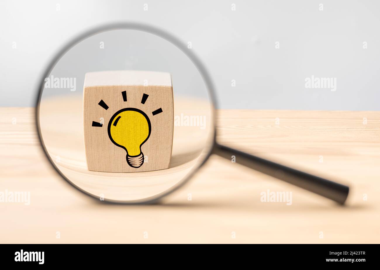 Magnifying glass with light bulb icon. Concept creative idea and innovation. Idea and imagination. Creative and inspiration. Magnifying glass with lig Stock Photo