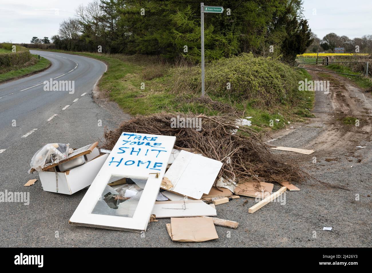 Local residents express their anger at the illegal dumping of waste on a quiet country lane in Herefordshire, UK, on the day that the government announces a new crackdown on fly-tipping Stock Photo