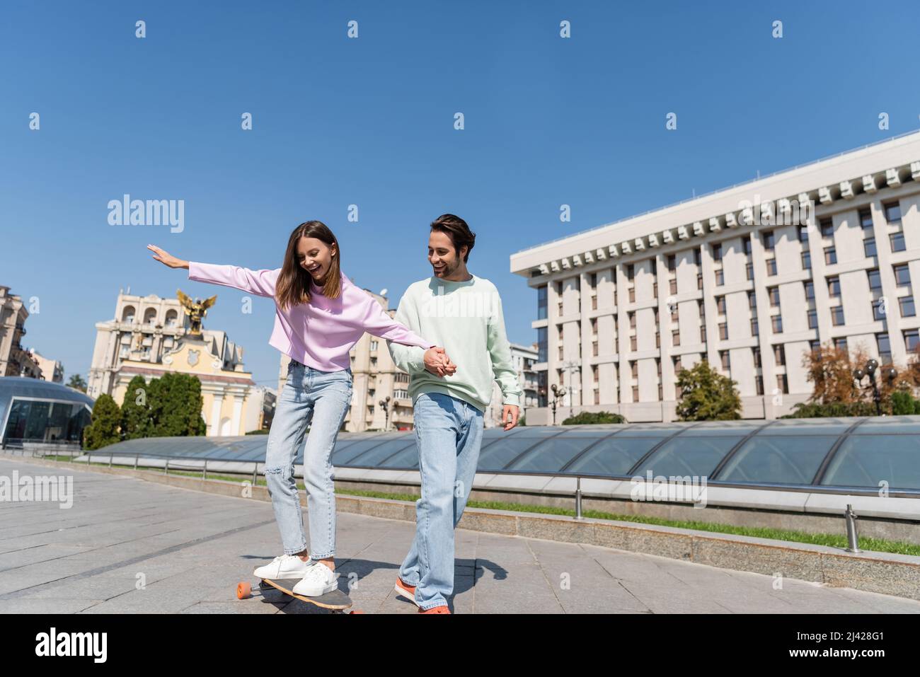 Woman riding penny board hi-res stock photography and images - Alamy