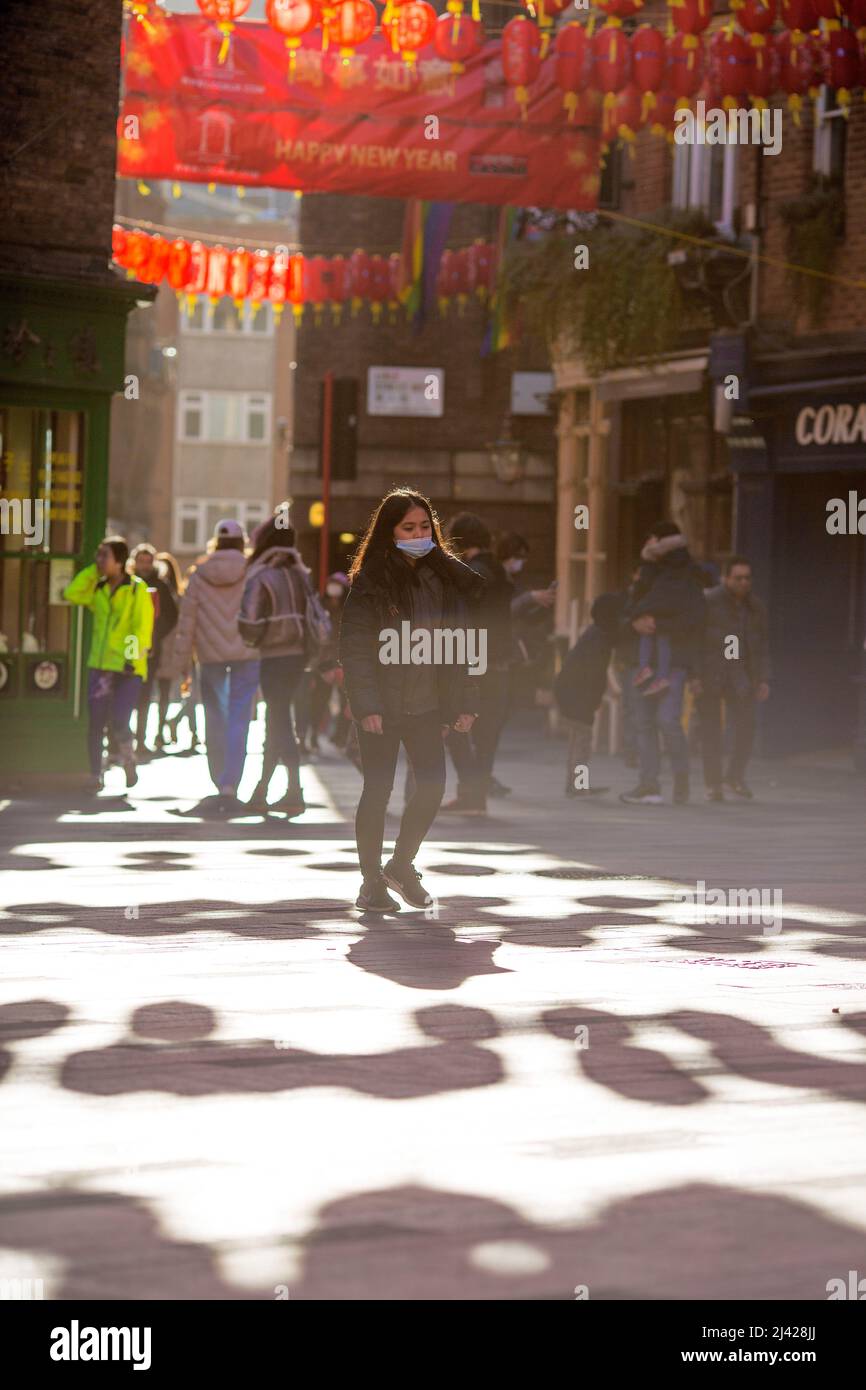 People stroll in Chinatown, central London, as the Lunar New Year falls on 1 February this year. Stock Photo