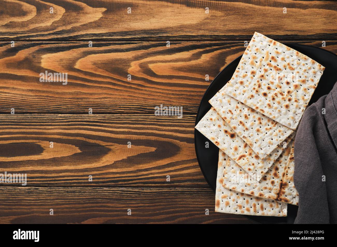 Passover celebration concept. Matzah, red kosher and walnut