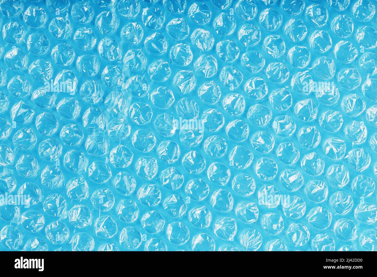 Packing bubble wrap for parcels on a blue background in full screen Stock Photo Alamy