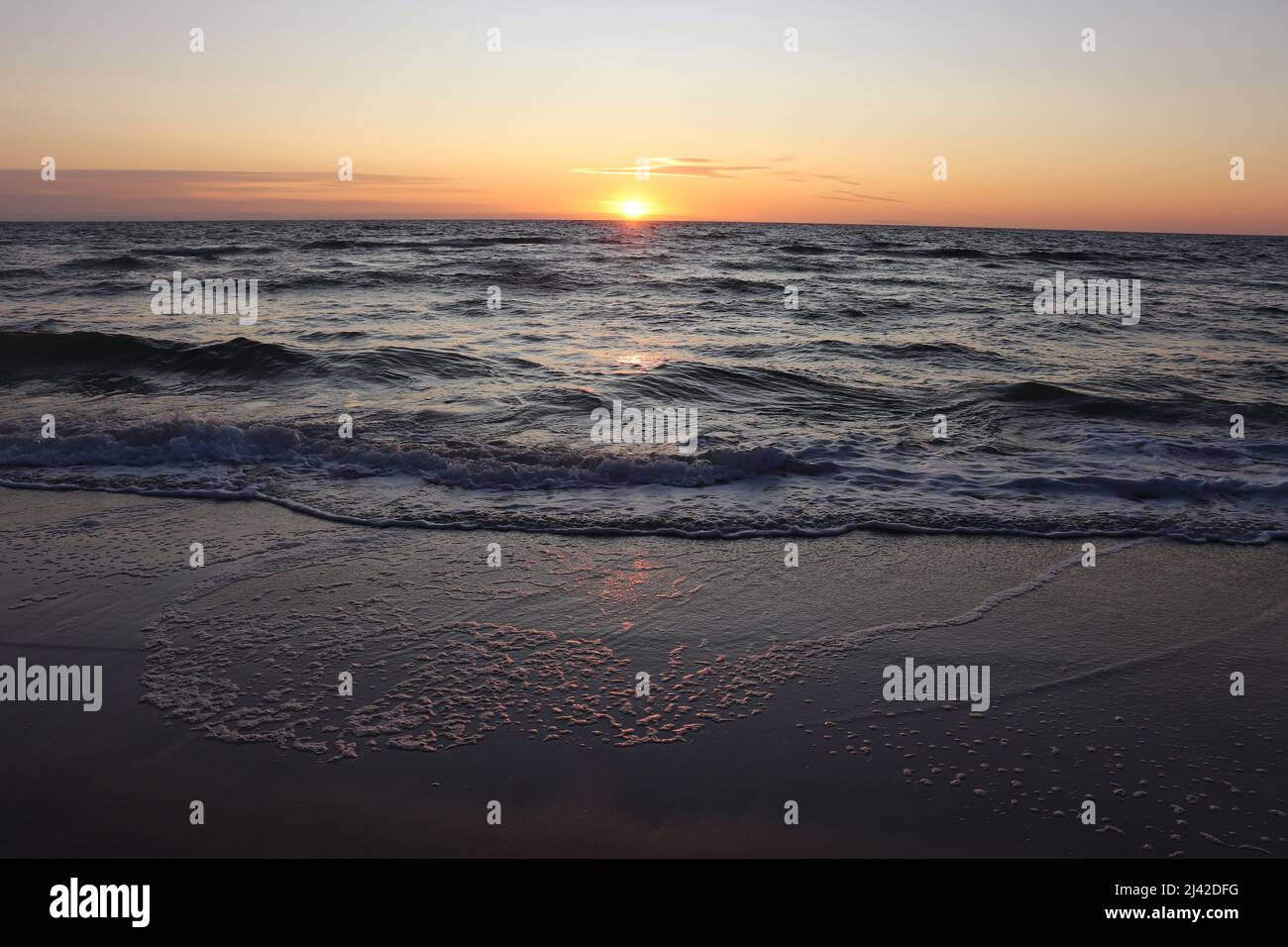 Sunset at the beach Stock Photo - Alamy